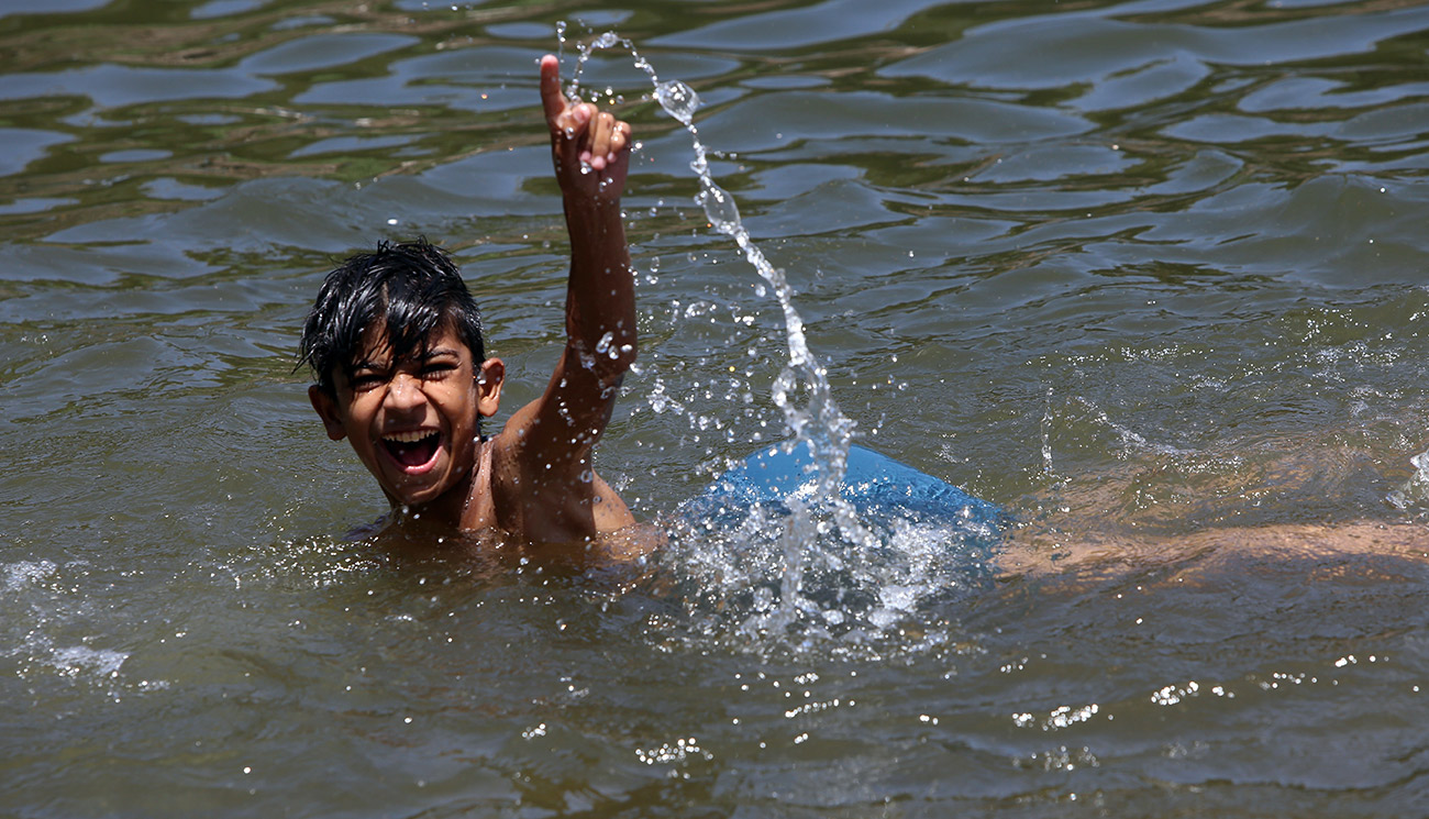 Boy playing in river